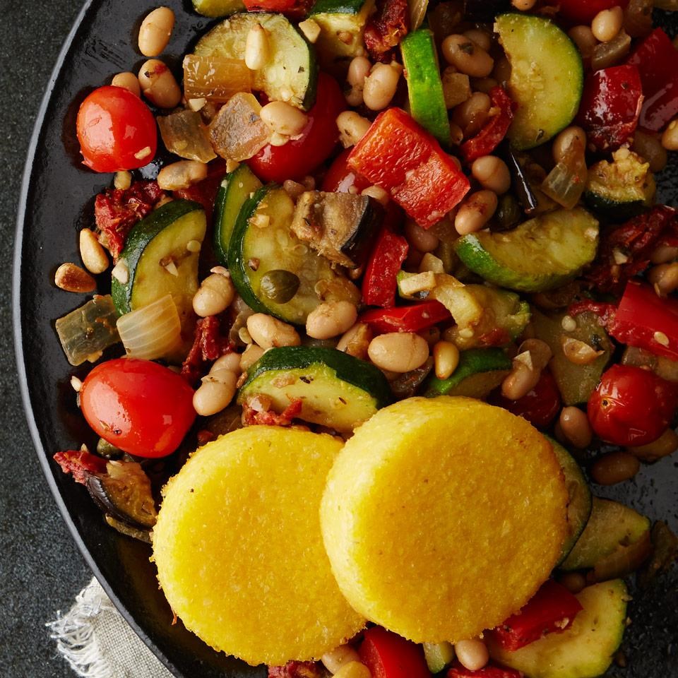 a healthy meal with beans, cucumber, and cherry tomatoes